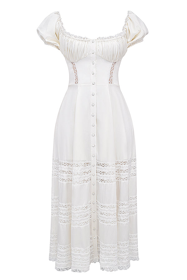 Abito color avorio realizzato in vera seta con maniche a sbuffo