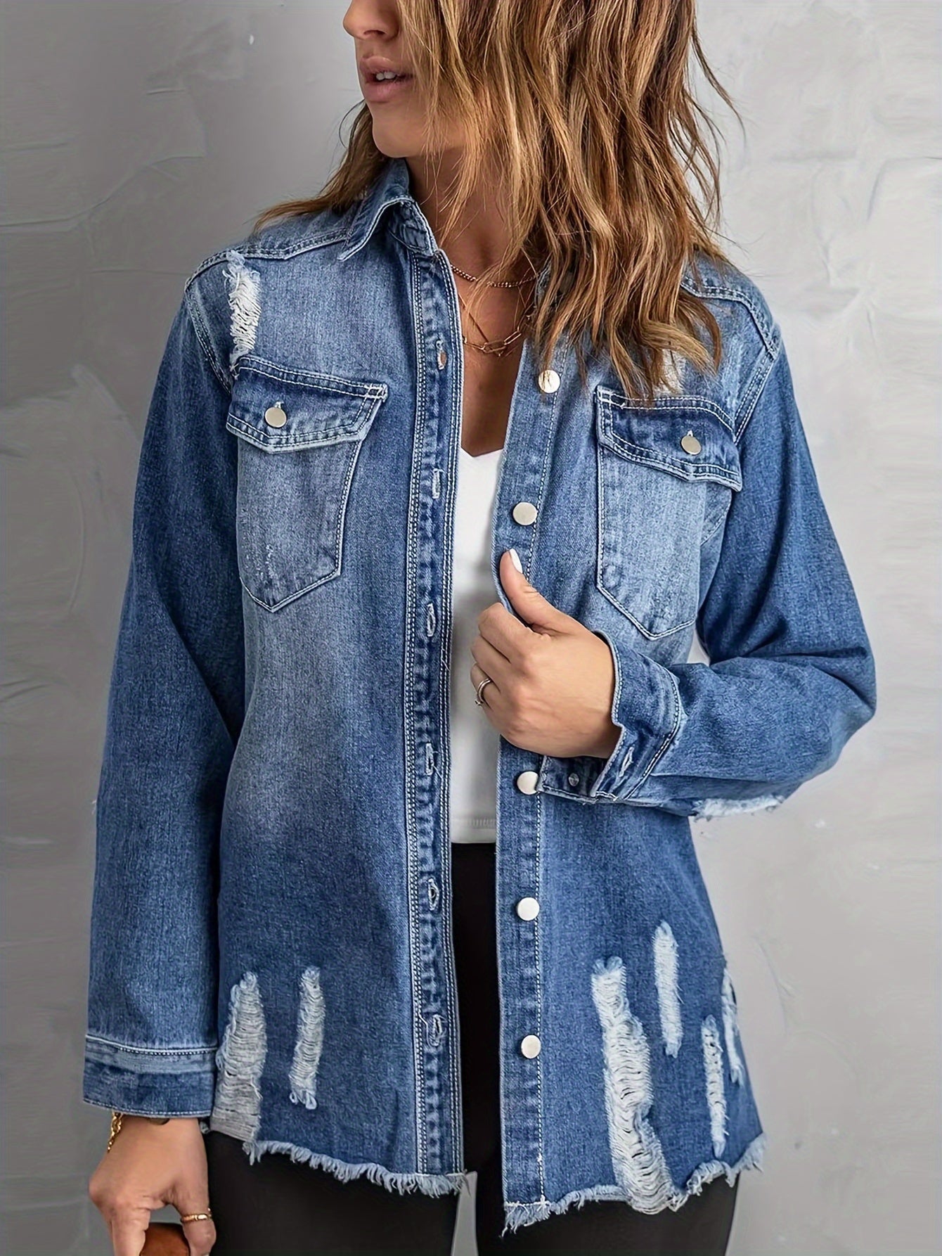 Giacca in denim con strappi sui revers