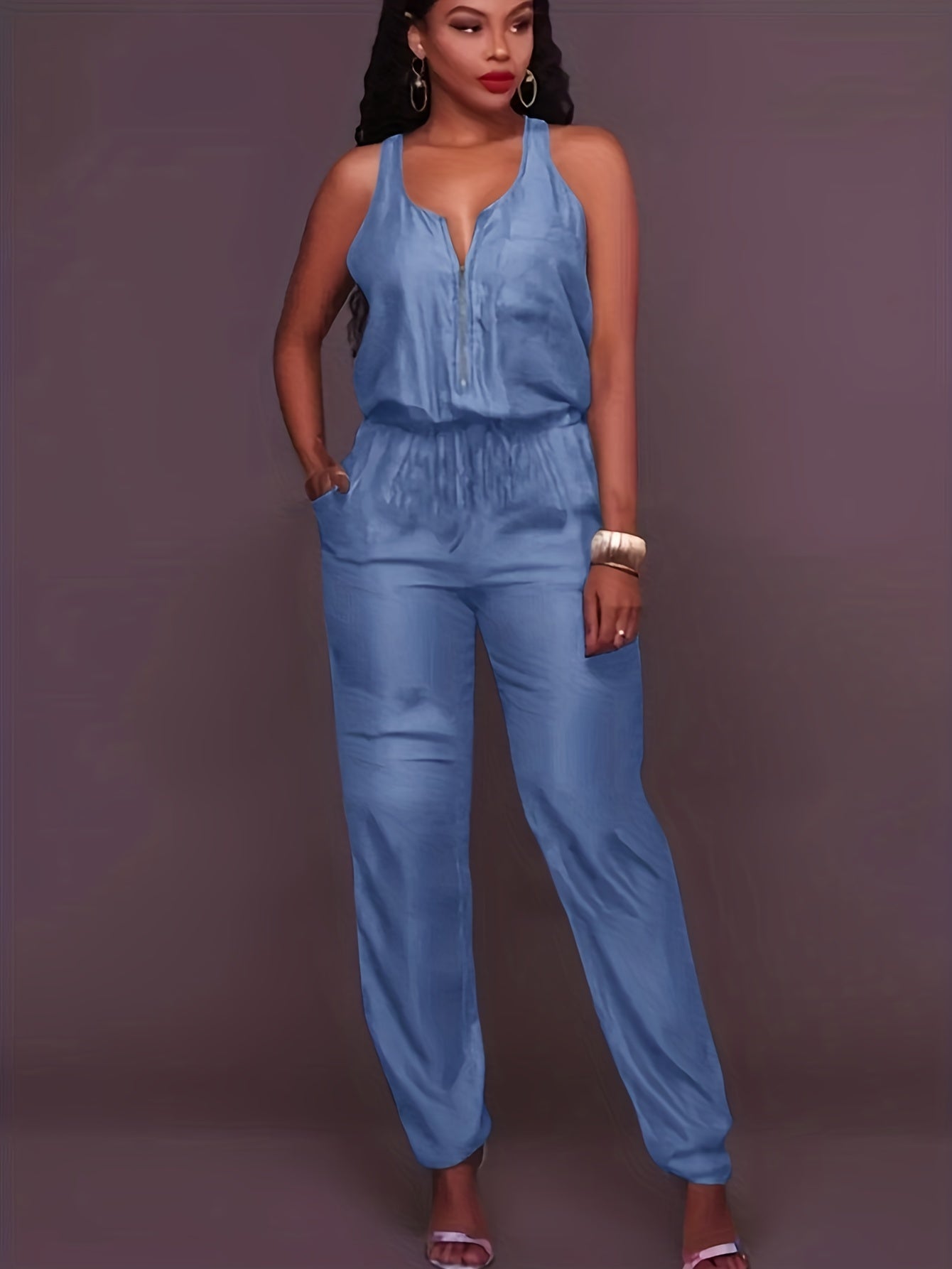 Tuta in denim con cerniera frontale e cintura