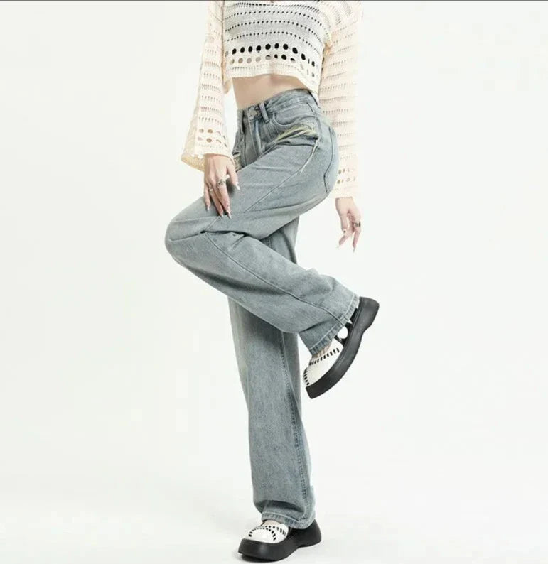 Jeans a vita alta con tasche strappate