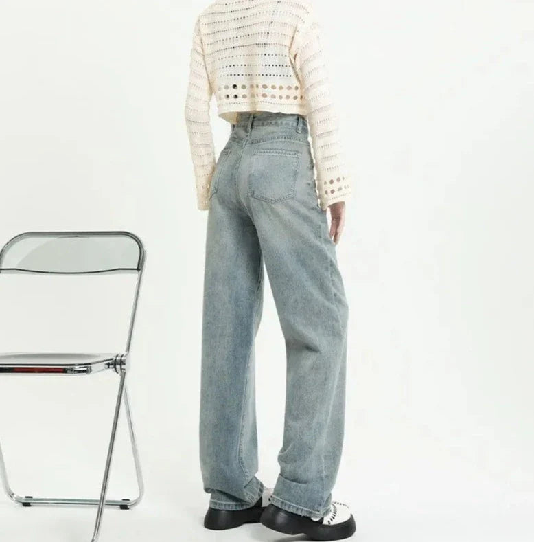 Jeans a vita alta con tasche strappate