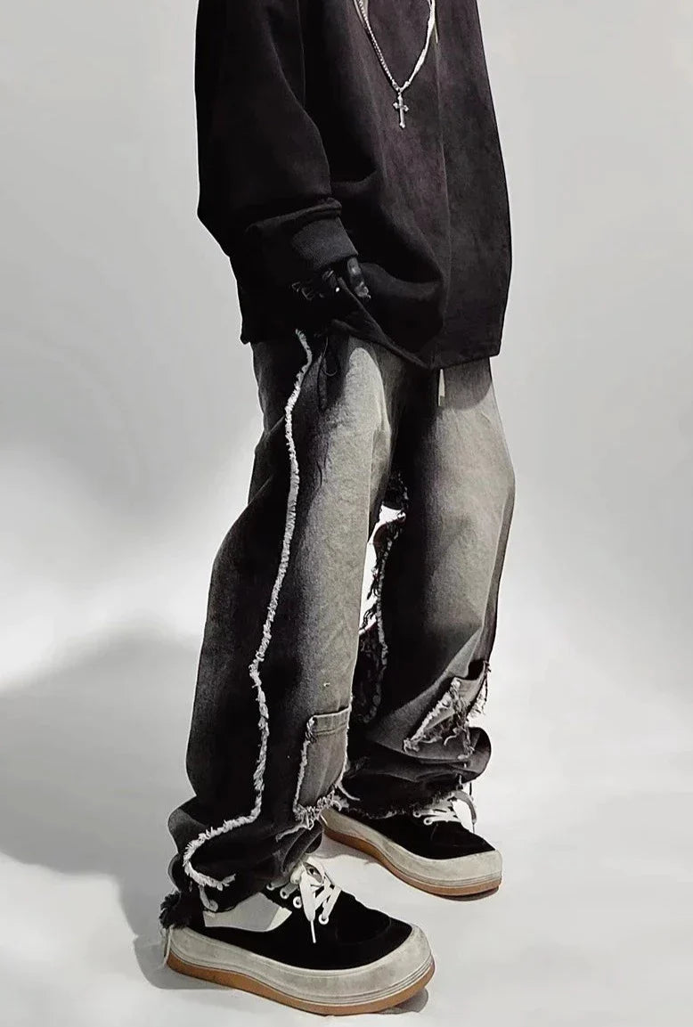 Jeans neri oversize strappati