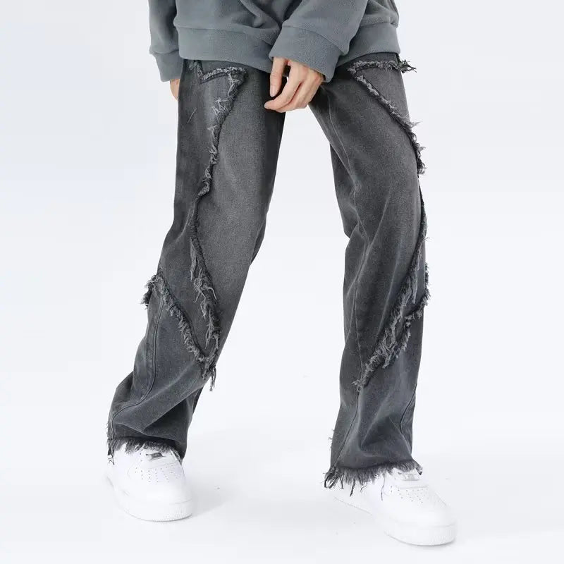 Jeans oversize strappati