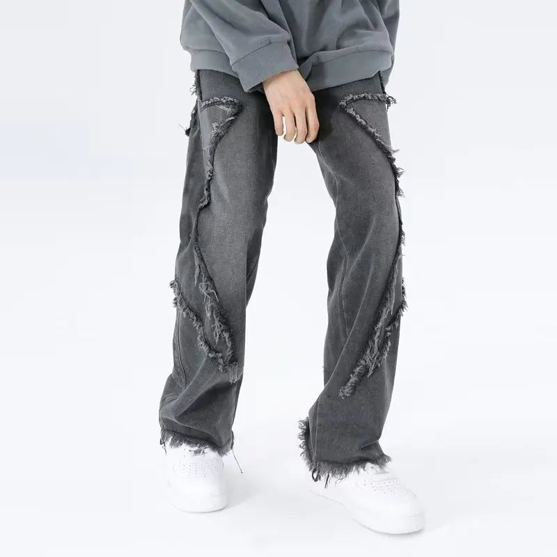 Jeans oversize strappati