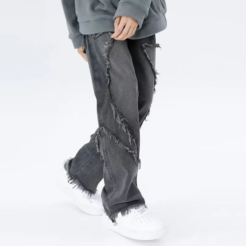 Jeans oversize strappati