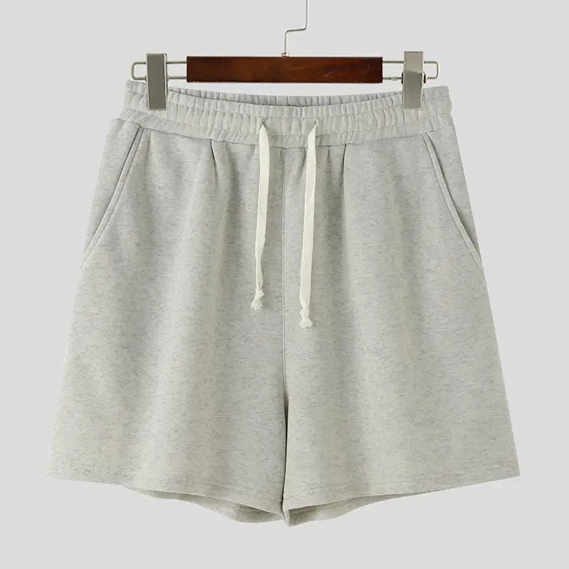 Felpa a maniche lunghe e pantaloncini con cappuccio