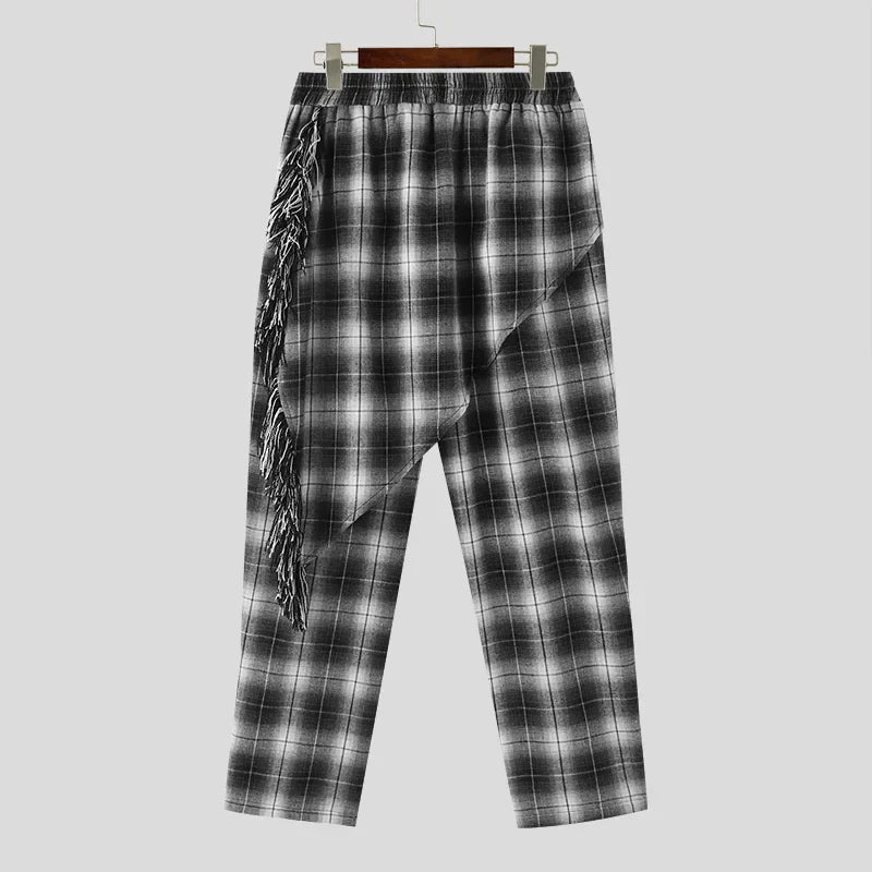 Cardigan a quadri con maniche lunghe e punto aperto e pantaloni con gonne irregolari