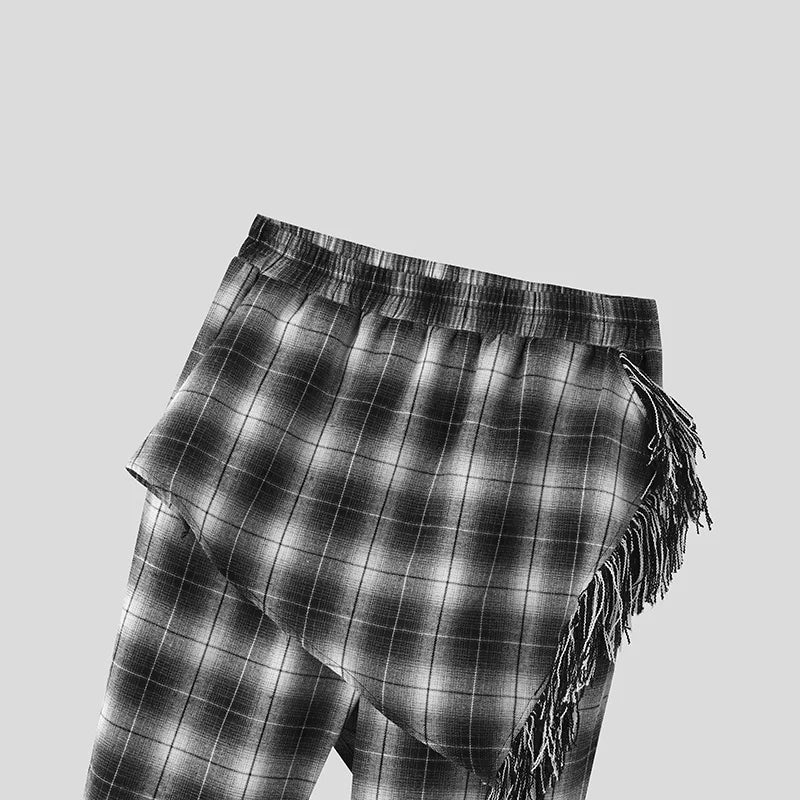 Cardigan a quadri con maniche lunghe e punto aperto e pantaloni con gonne irregolari