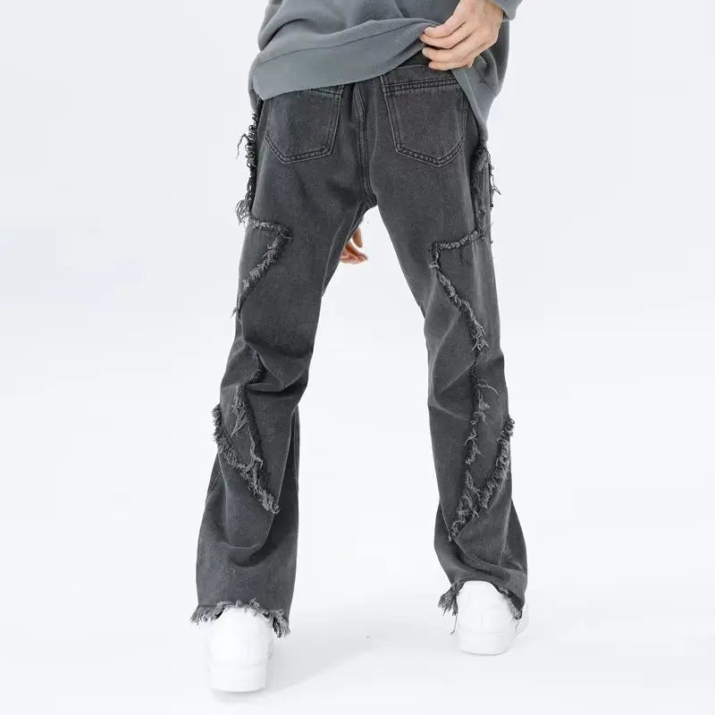 Jeans oversize strappati