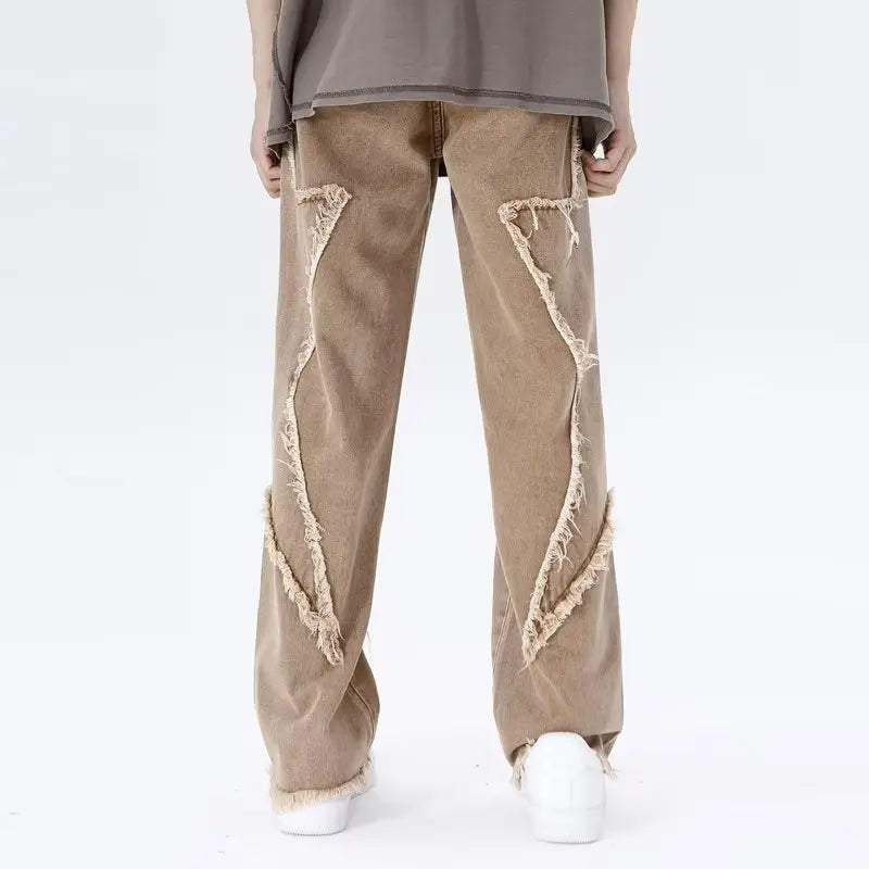 Jeans oversize strappati