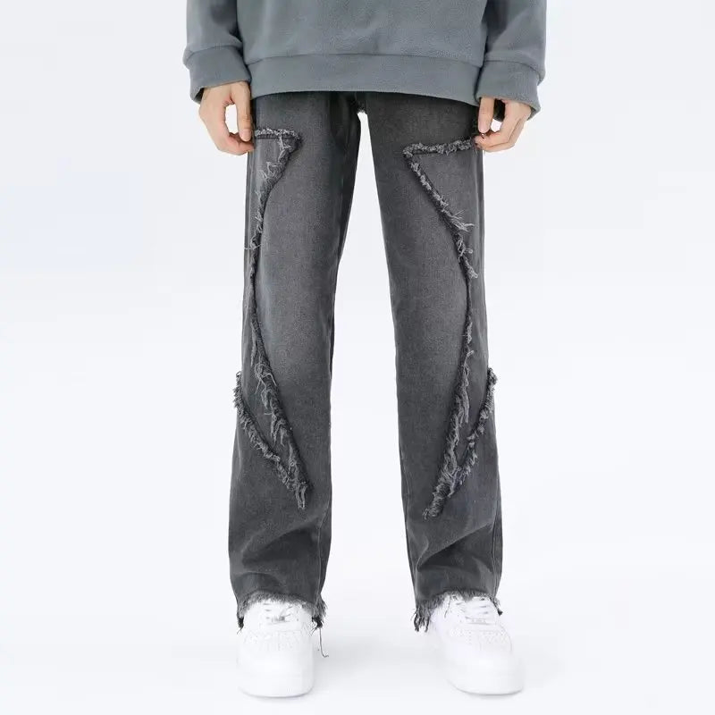 Jeans oversize strappati