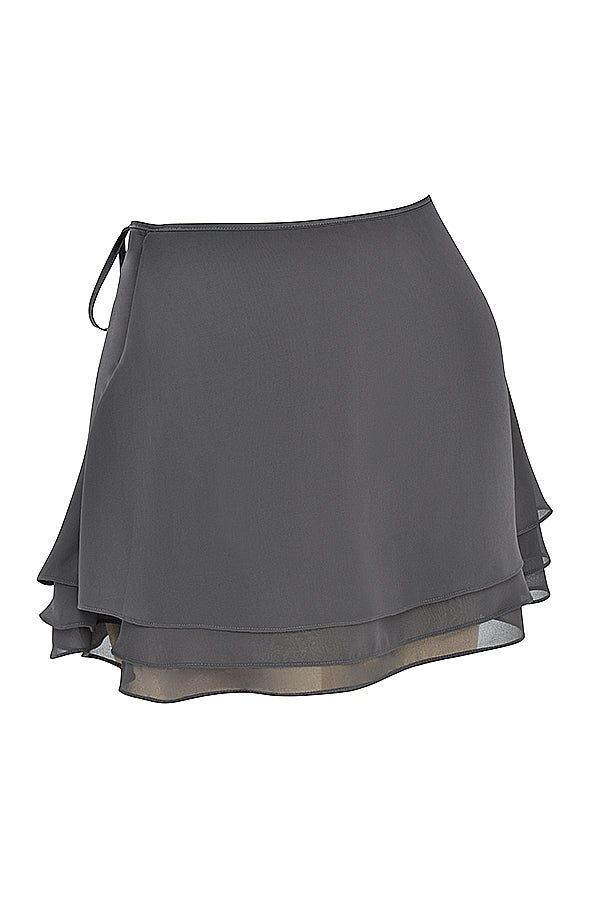 Top fluttuante a maniche lunghe Shadow e minigonna a strati