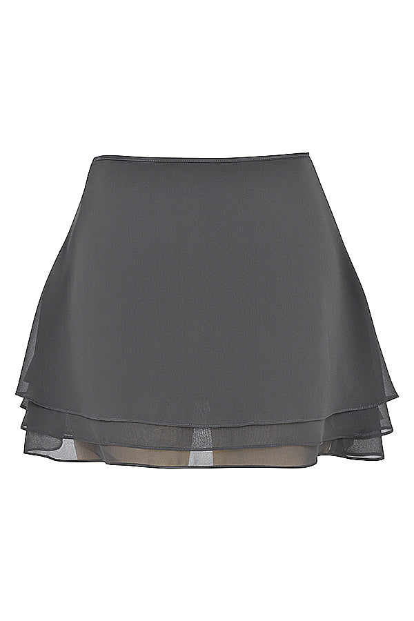 Top fluttuante a maniche lunghe Shadow e minigonna a strati