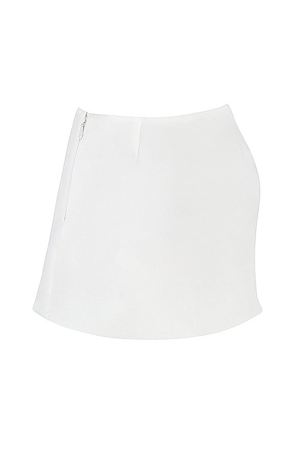Top in pizzo bianco con minigonna a trapezio in lino