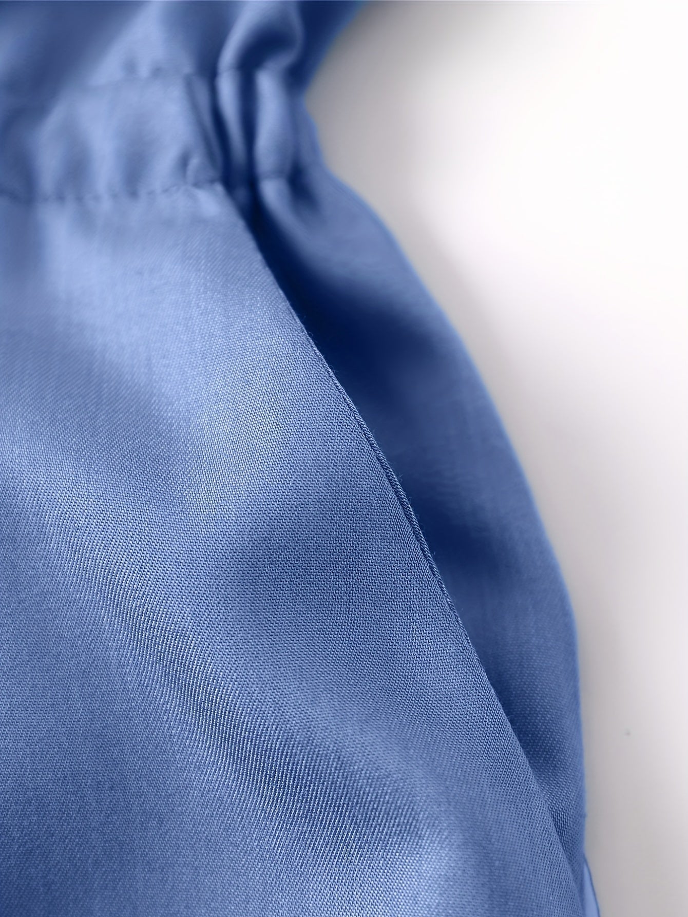 Tuta in denim con cerniera frontale e cintura