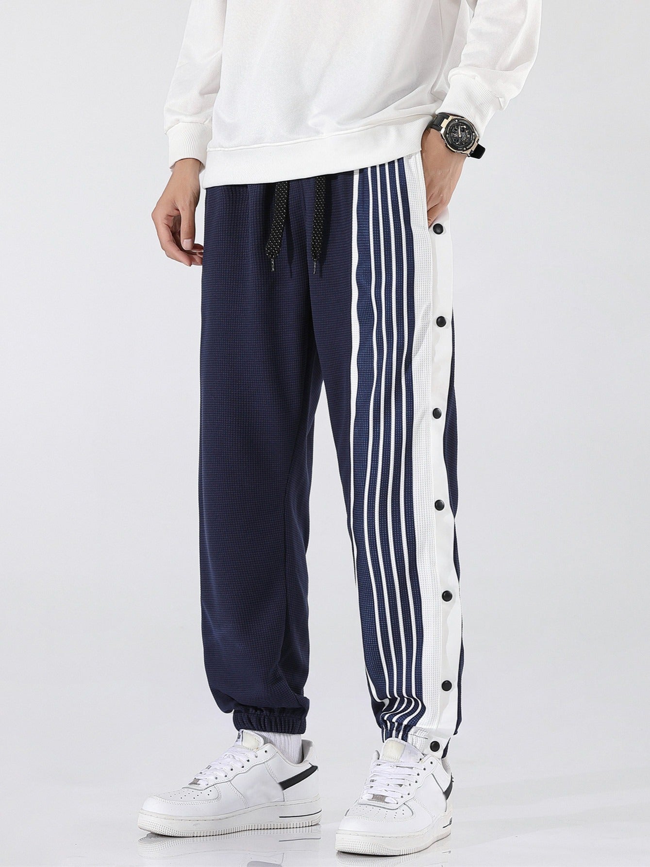 Pantaloni sportivi a righe da uomo
