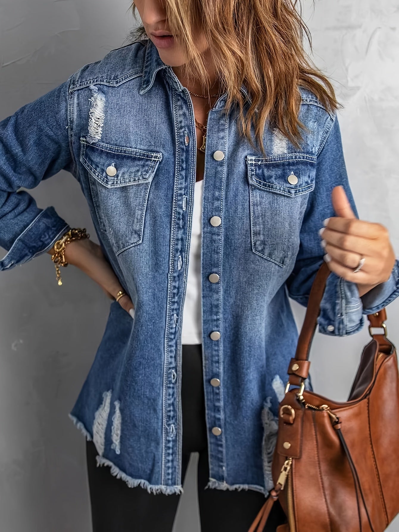 Giacca in denim con strappi sui revers