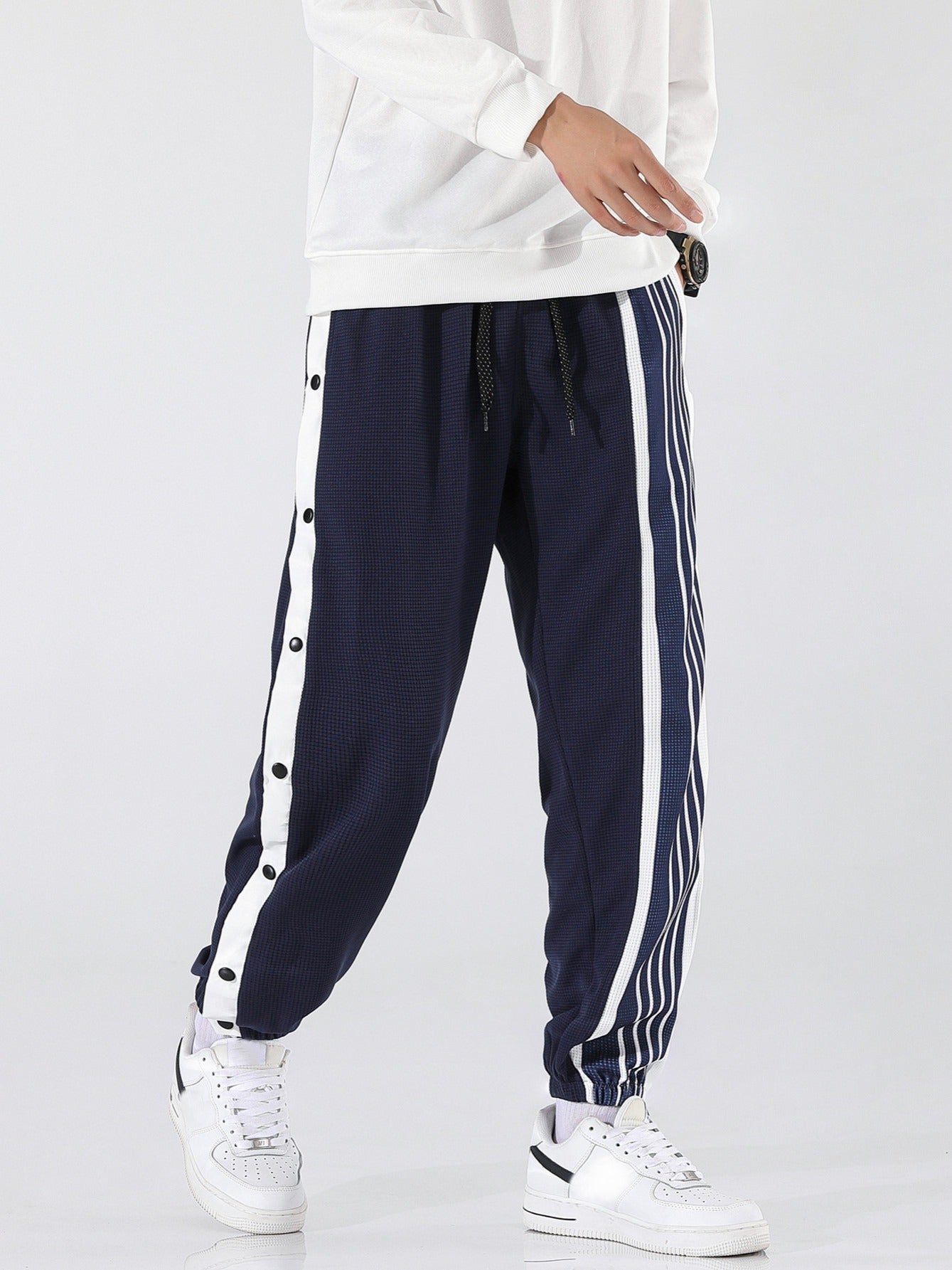 Pantaloni sportivi a righe da uomo