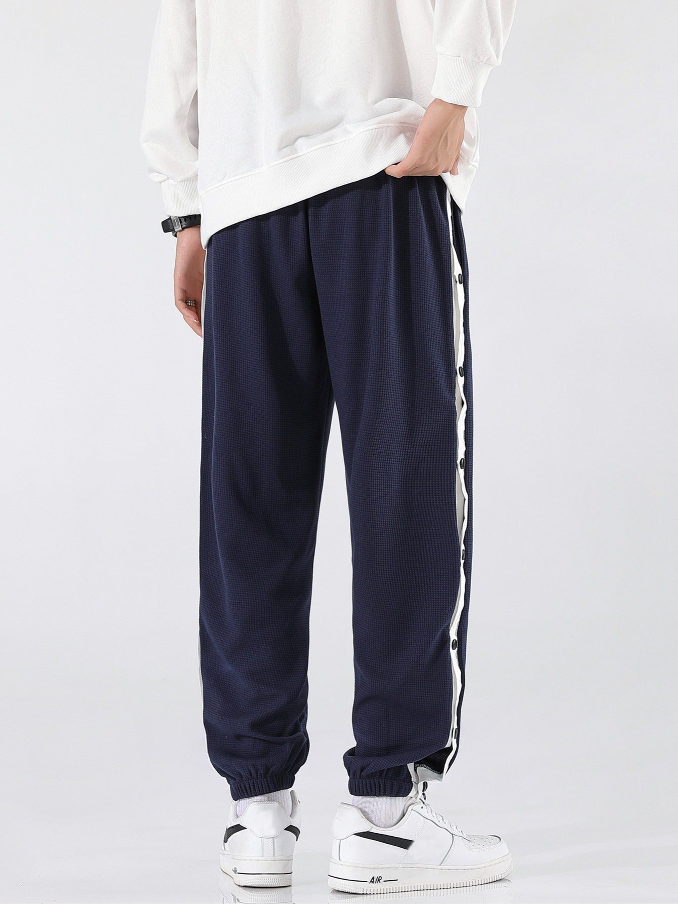 Pantaloni sportivi a righe da uomo