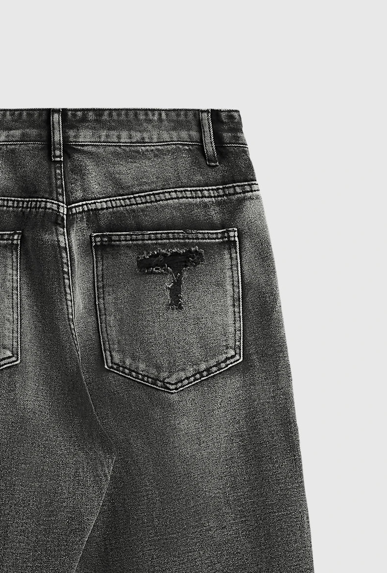 Jeans neri strappati