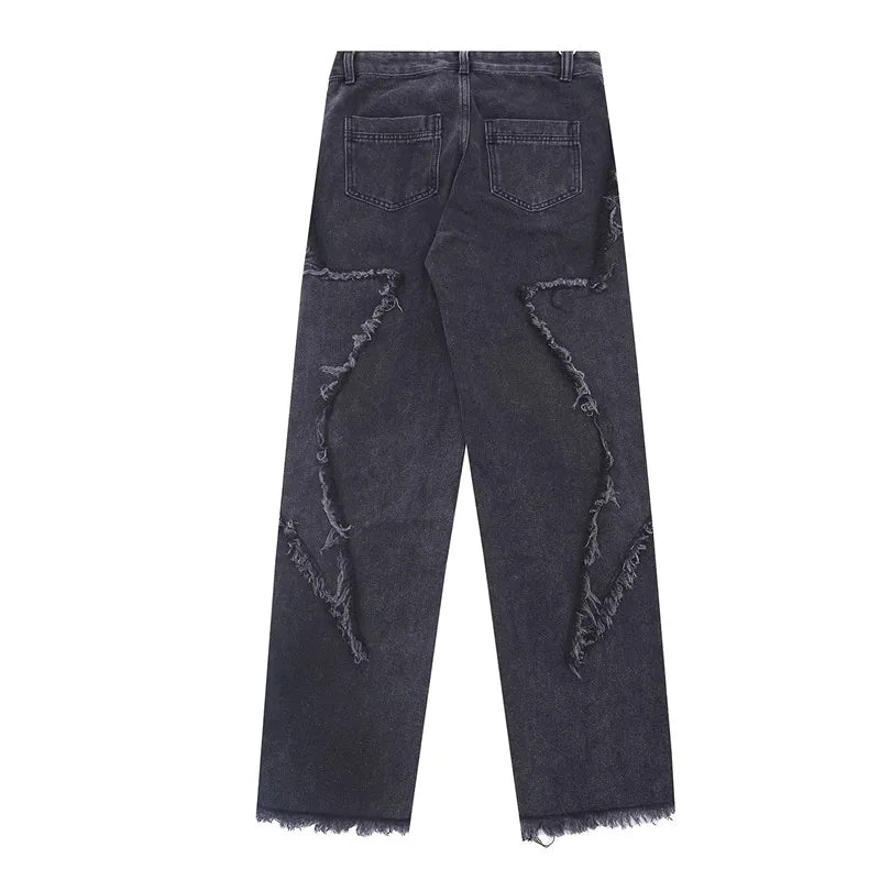Jeans oversize strappati