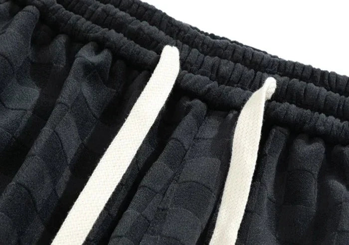 Pantaloni sportivi ampi con fantasia a scacchiera