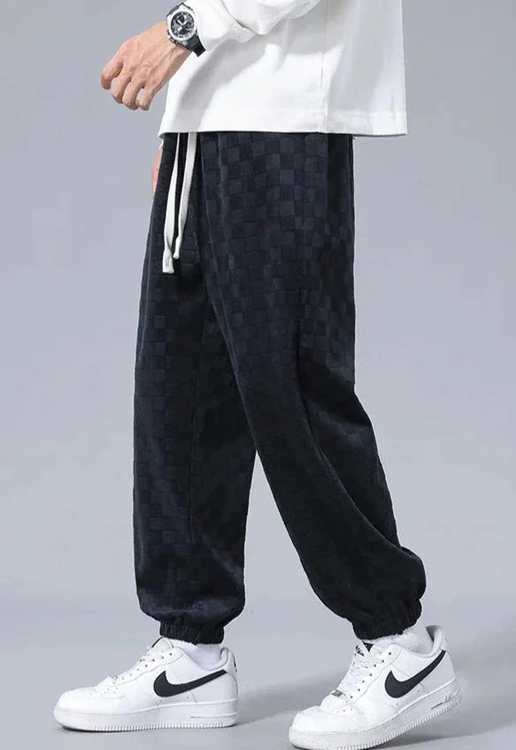 Pantaloni sportivi ampi con fantasia a scacchiera