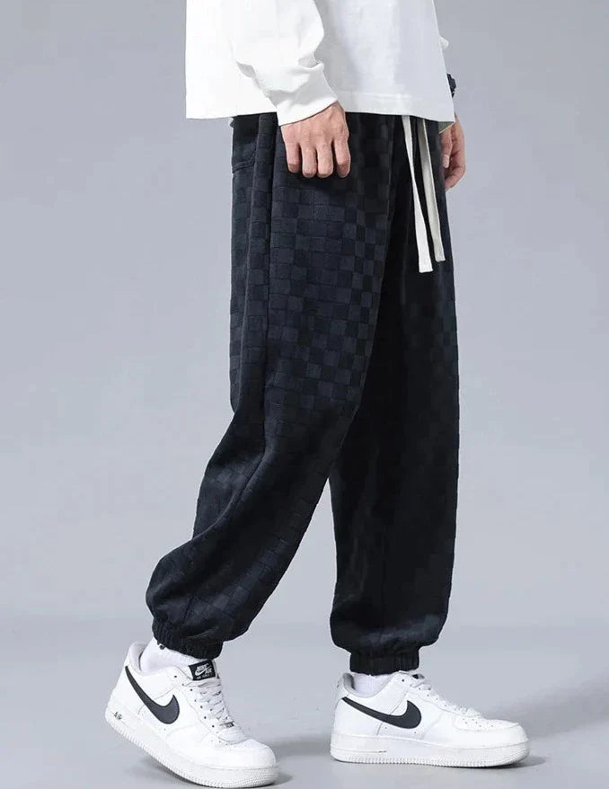 Pantaloni sportivi ampi con fantasia a scacchiera