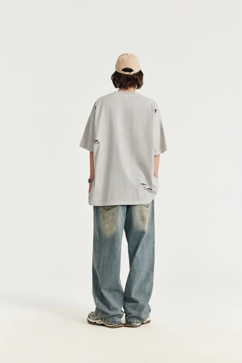 T-shirt oversize ricamata strappata e bucata