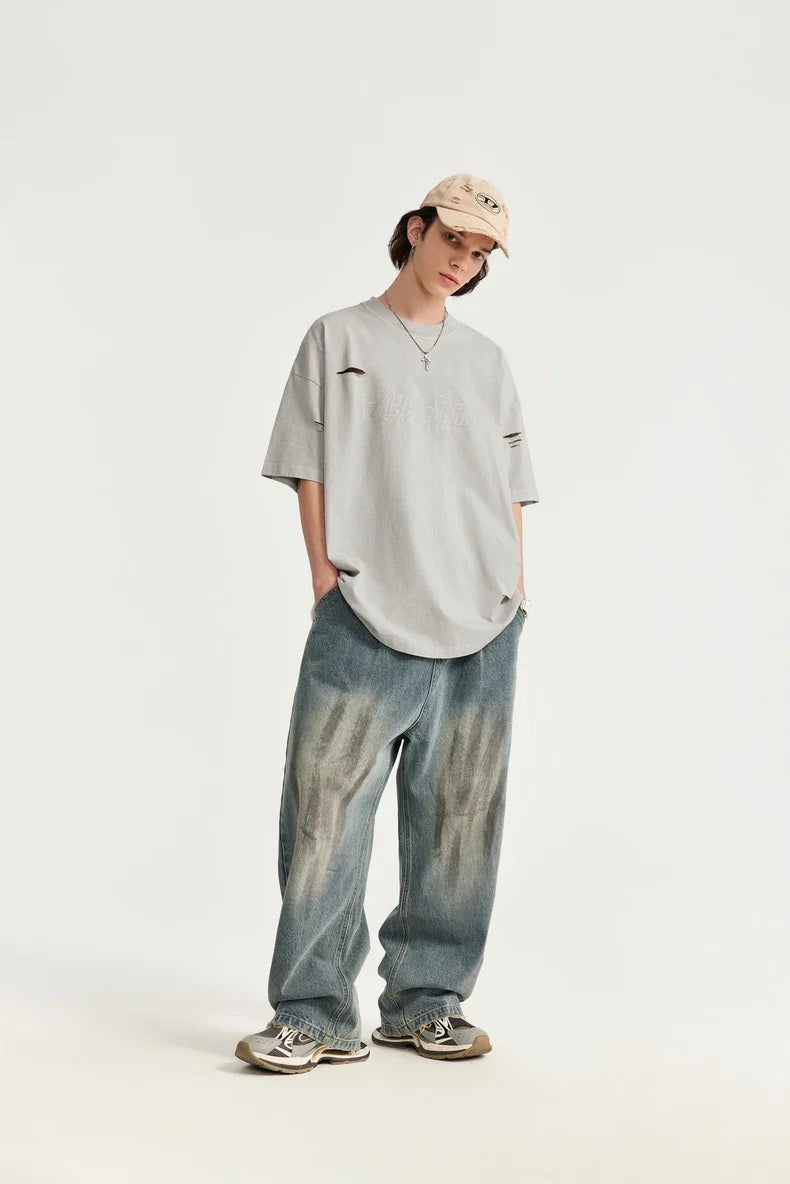 T-shirt oversize ricamata strappata e bucata