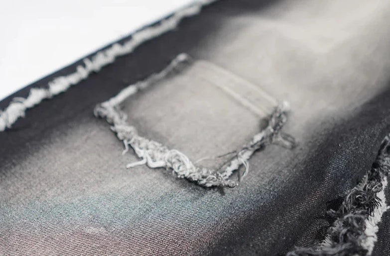 Jeans neri oversize strappati