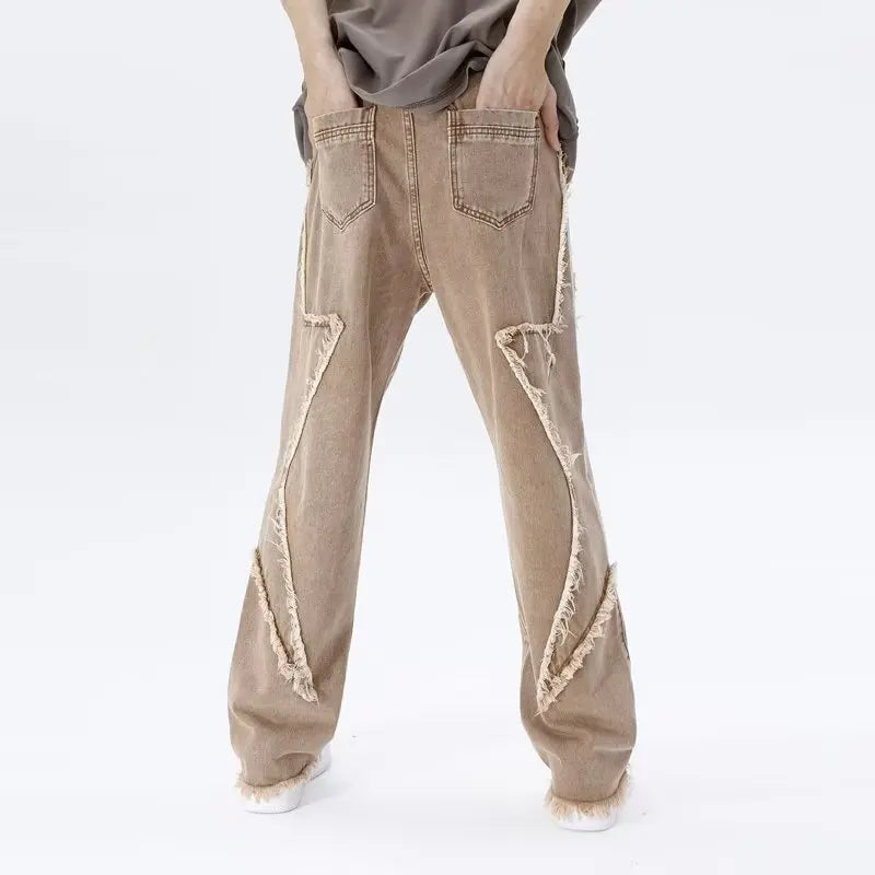 Jeans oversize strappati