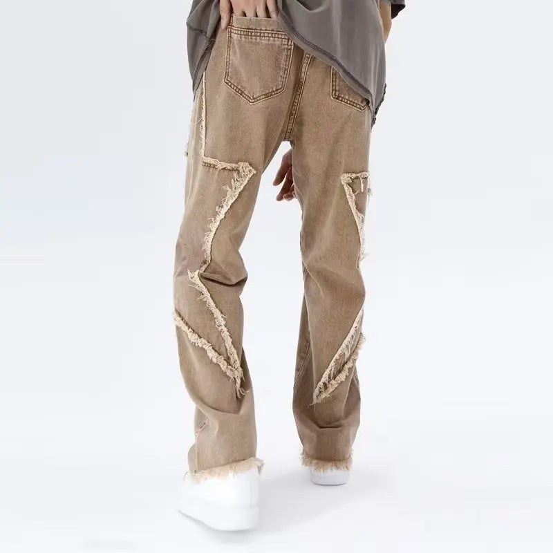 Jeans oversize strappati