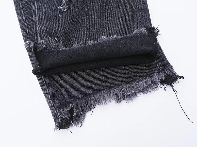 Jeans oversize strappati