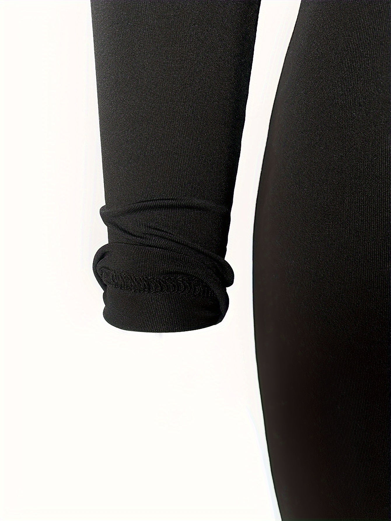 Set sportivo composto da top corto a maniche lunghe e pantaloni skinny a vita alta