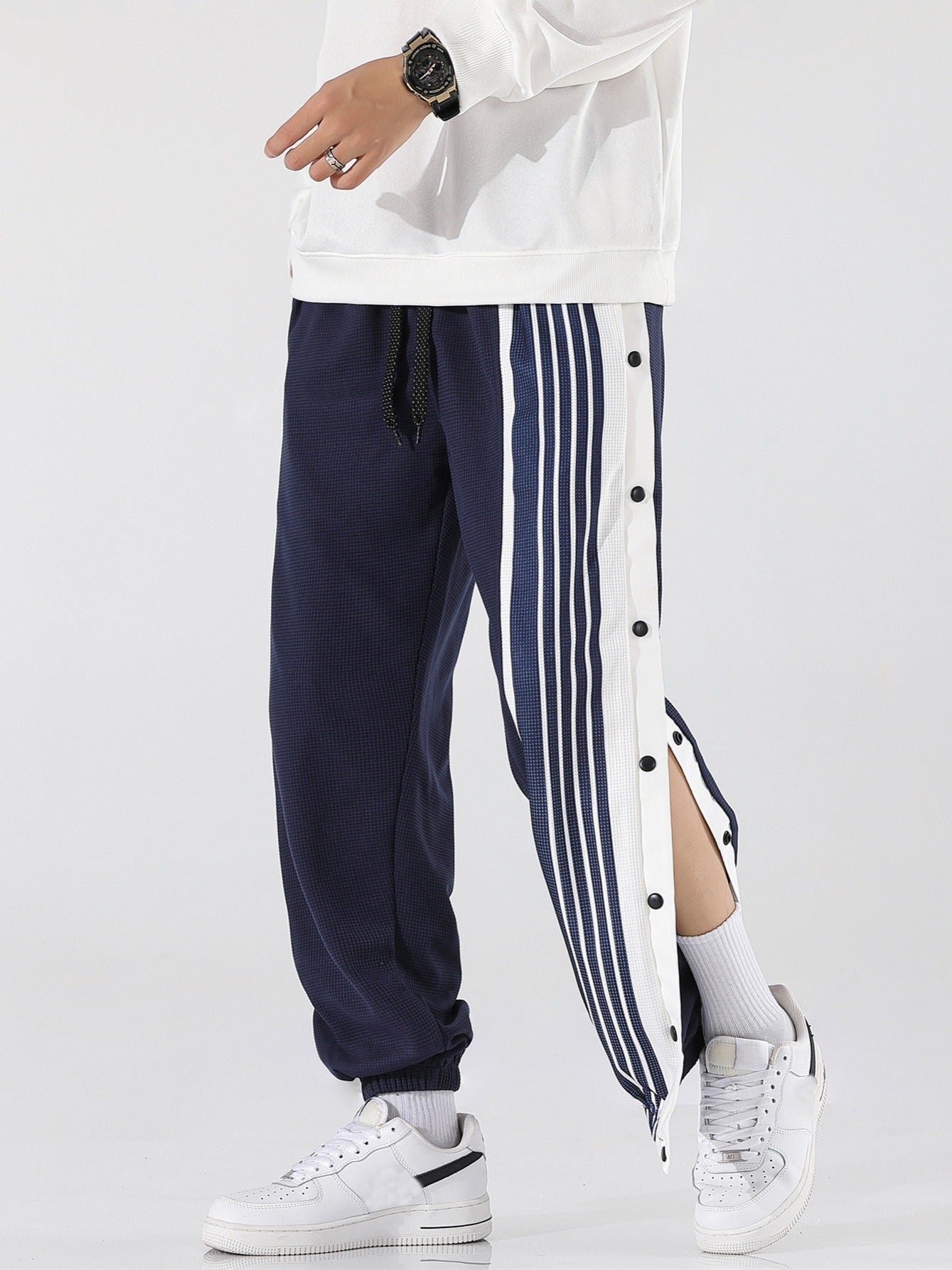 Pantaloni sportivi a righe da uomo