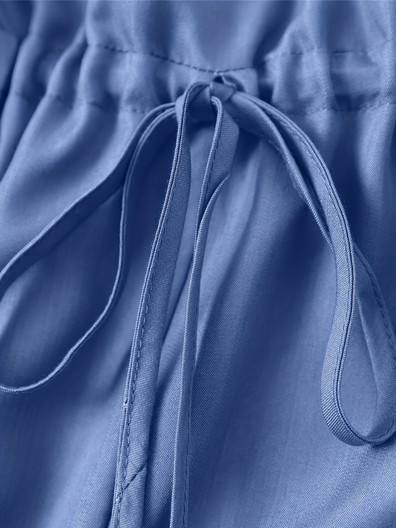 Tuta in denim con cerniera frontale e cintura