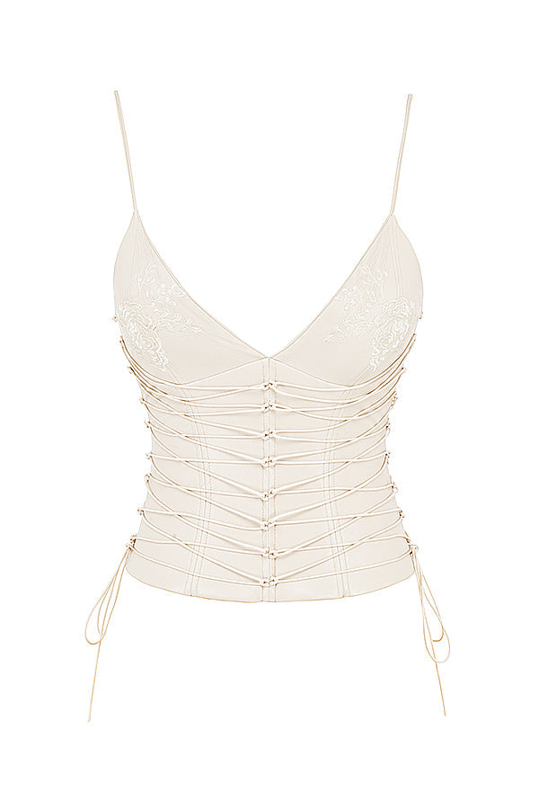 Corsetto in pelle vegana bianca con gonna midi drappeggiata
