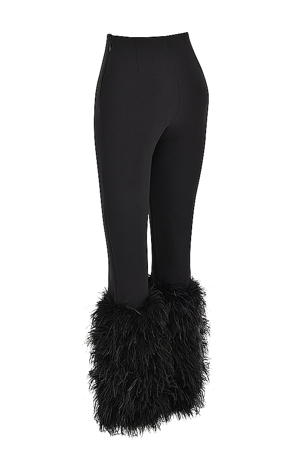 Corsetto di velluto nero con pantaloni cropped